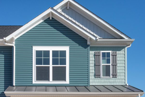 Luxury single family home with natural wood look rough shake fin house-exteriors-vinyl-siding-cedar-brick